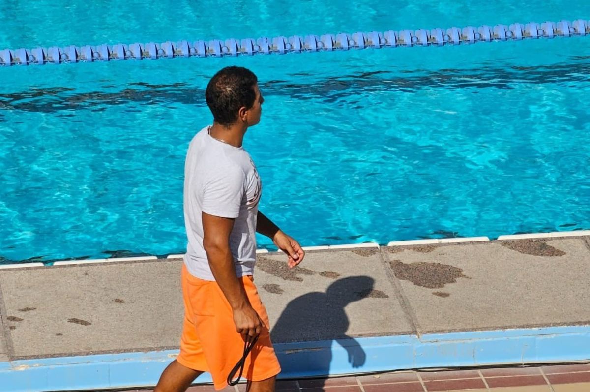 Captain Mahmoud walking along the pool deck